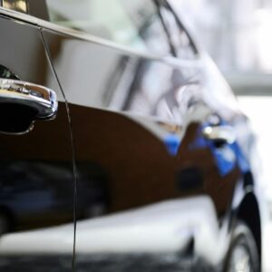 A close up of the side view mirror on a car.