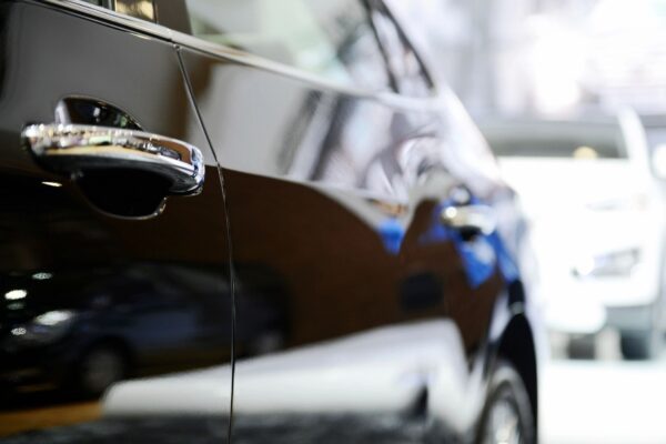 A close up of the side view mirror on a car.